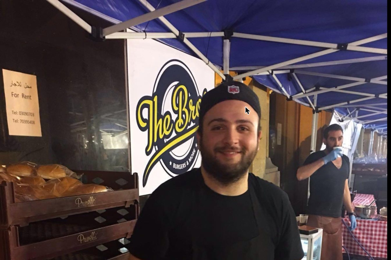 The Bros market stall in 2016, under a blue tent with the original logo